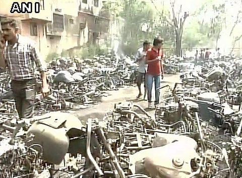 Over 200 vehicles were gutted in the fire that broke out at the parking lot of the Raipur station on Sunday. (ANI)