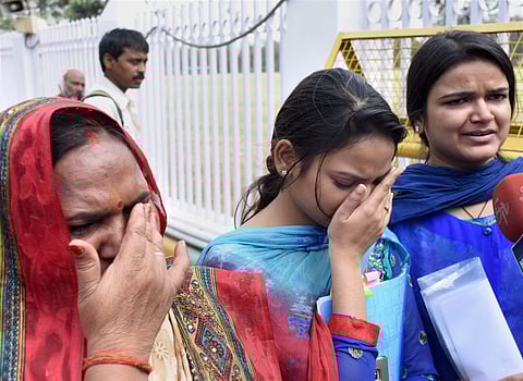 Family members of rape accused former UP cabinet minister Gayatri Prajapati returning from the Chief Minister Yogi Adityanath's residence in Lucknow on Monday after he refused to meet them. | PTI