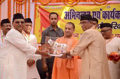 Uttar Pradesh Chief Minister Yogi Adityanath being presented a memento at a function at RSS office Madhavdham in Gorakhpur on Sunday. (Photo | PTI)