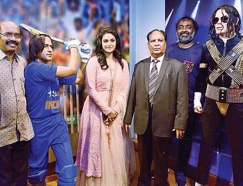 Artist AP Shreethar and actor Keerthy Suresh with the wax statues