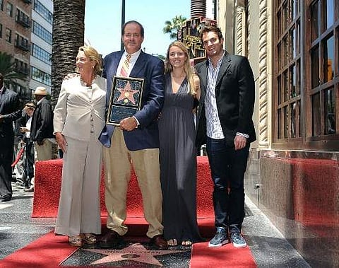 ESPN sportscaster Chris Berman poses with his family after being honored by a Star on the Hollywood Walk of Fame, on May 24, 2010 in Hollywood, California. | AFP