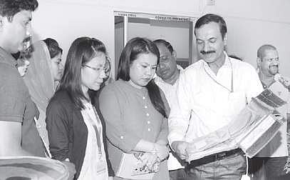 Scientist Ramakrishna A explains about reusable food warmer pouches and fresh curd maker at DFRL in Mysuru on Thursday | Express