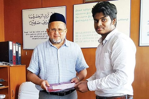 M Dhanush with the secretary of the college