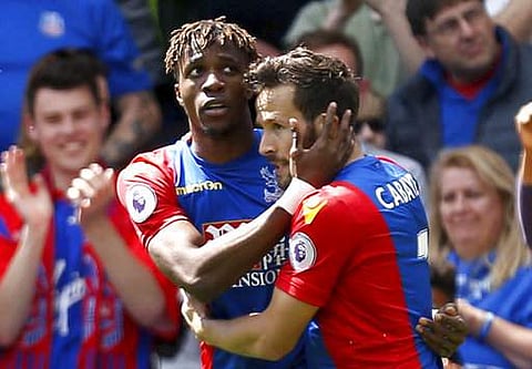 Crystal Palace's Wilfried Zaha, left, celebrates scoring his side's first goal of the game with teammate Yohan Cabaye, during the English Premier League soccer match between Crystal Palace and Hull City. | AP