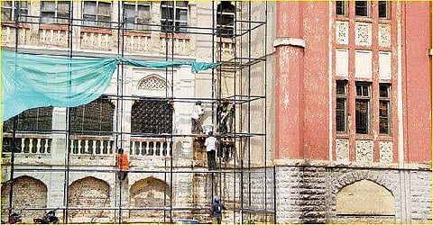 Workers taking up renovation works at the heritage building of Government City college in Old City in Hyderabad | sathya keerthi