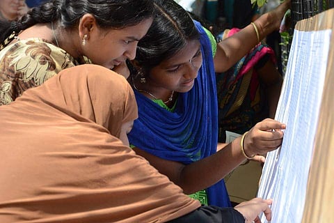 Girls look at their 10th standard board exam results. (Photo: EPS|M K Ashok Kumar)