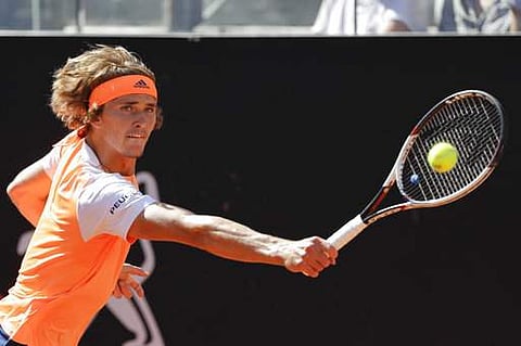 Germany's Alexander Zverev returns the ball during his semi final match against John Isner, of the United States, at the Italian Open tennis tournament. | AP