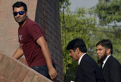 Suspended Pakistani cricketer Shahzaib Hasan (L) arrives with his lawyers to appear before a tribunal in Lahore on March 31, 2017. (File | AFP)