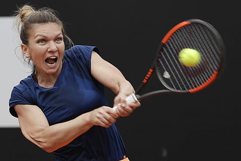 Romania's Simona Halep returns the ball during her semifinal match against Netherlands Kiki Bertens at the Italian Open tennis tournament. | AP