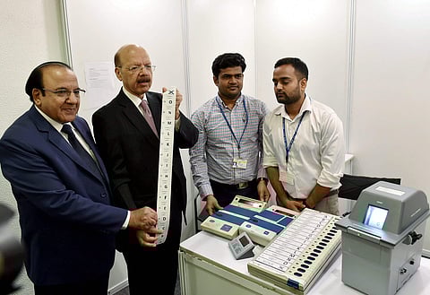 Chief Election Commissioner Nasim Zaidi along with Election Commissioners A K Joti demonstrating the working of Electronic Voting Machines EVMs and Voter Verifiable Paper Audit Trail System VVPATs while brushing aside the EVM tampering allegation before a