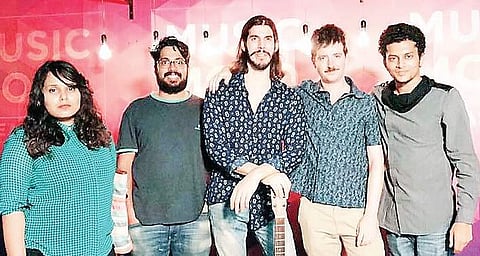 Matt Bacon (middle) with band members