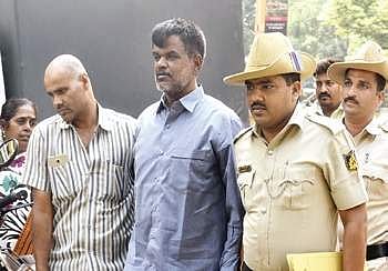 Nagaraj being taken to a city court, at Mayo Hall on Monday | Vinod Kumar T