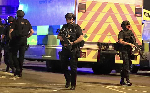 Armed police respond after reports of an explosion at Manchester Arena during an Ariana Grande concert in Manchester, England. | AP