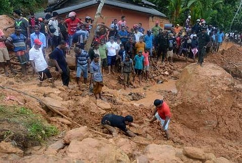 Sri Lankan military rescue workers and villagers search for survivors at the site of a mudslide in Bellana village in Kalutara on May 26, 2017. (File Photo | AFP)