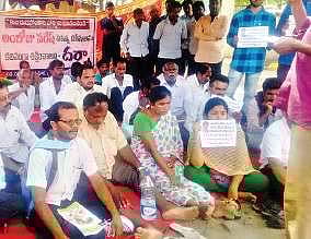 Naresh’s parents along with civil society members stage a dharna in Bhuvanagiri on Sunday | Express photo