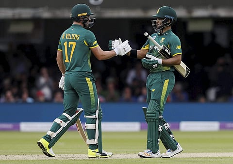 South Africa's JP Duminy right shakes hands with AB de Villiers as they win the third One Day International cricket match between England and South Africa at Lord's cricket ground in London Monday May 29 2017.  | AP