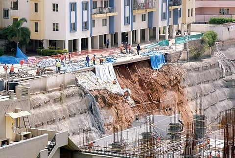 The wall beside Sree Utopia complex which collapsed due to dynamite explosions at the adjacent construction site; (inset) a crack that developed in Sree Utopia building  | nagaraja gadekal