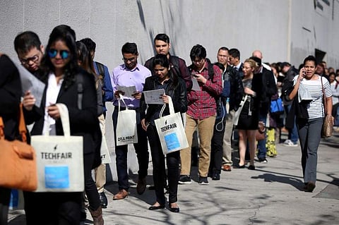 People wait in line to attend TechFair LA, a technology job fair, in Los Angeles on January 26. (File Photo | Reuters)