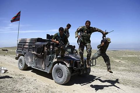 Afghan commandos arrive at Pandola village near the site of a US bombing in the Achin district of Jalalabad, east of Kabul. (File Photo | AP)