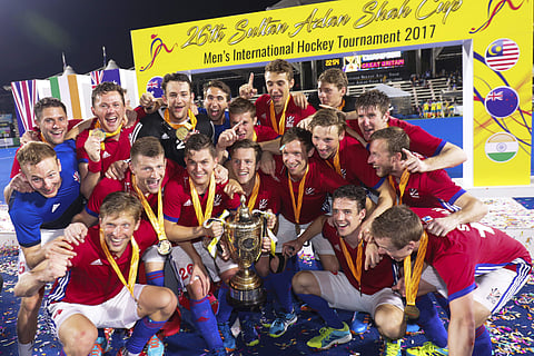 Great Britain players celebrate with the trophy after winning the men's field hockey match at the Sultan Azlan Shah Cup in Ipoh. | AP