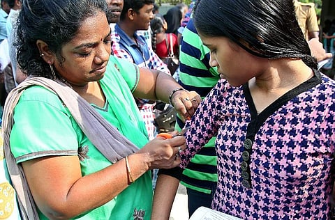 Sleeves of students being cut off before enetering the NEET exam centre in Chennai. (Romani Agarwal | EPS)