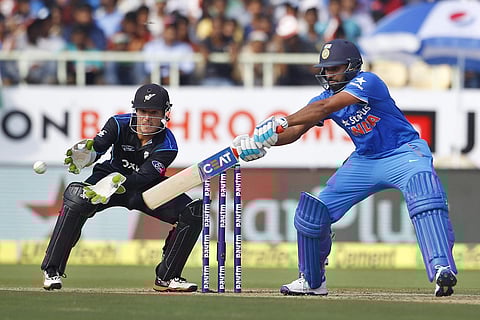 India's Rohit Sharma, right, plays a shot as New Zealand's wicketkeeper BJ Watling reacts during their fifth and last one day international cricket match in Visakhapatnam, India. | AP File Photo