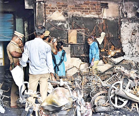 Forensics experts check the spot where a fire resulted in the four deaths (pictured on the right) on Monday; (below left) State Finance Minister D Jayakumar paid the neighbourhood a visit | P Jawahar