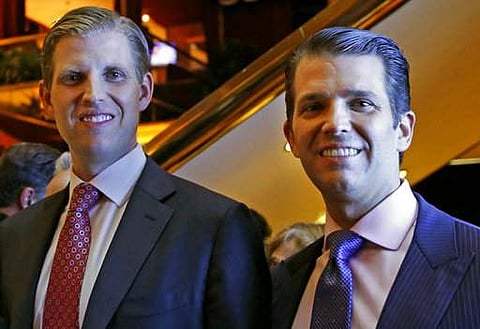 Eric Trump, left, and Donald Trump Jr., executive vice presidents of The Trump Organization, pose for a photograph at an event for Scion Hotels, a division of Trump hotel on June 5. (File Photo | AP)