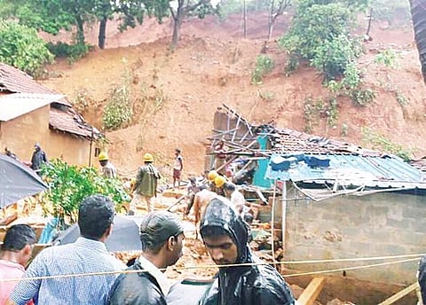 Fire personnel carry out rescue operations after a landslide in Tandrakuli of Kumta taluk, Uttara Kannada district, on Sunday
