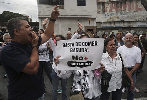 Demonstrators shout slogans against Venezuela's President Nicolas Maduro outside the Supreme Court to show support for the chief prosecutor's motion to stop President Nicolas Maduro's push to rewrite the constitution Caracas, Venezuela. (Photo | AP)