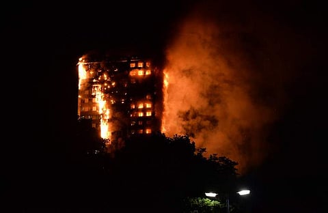 This handout image received by local resident Giulio Thuburn early on June 14, 2017 shows flames engulfing a 27-storey block of flats in west London. AP