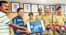 Gaana Bala (second from left) with a copy of the video on Tuesday | D SAMPATHkumar