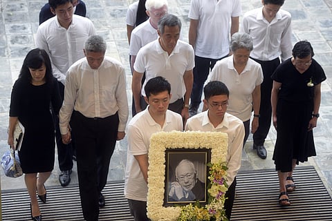 The family members second row left to right; Lee Suet Fern, son, (Lee Hsien Yang's wife), Lee Hsien Yang, Lee Hsien Loong, son and current prime minister, Ho Ching (Lee Hsien Loong's wife) and Lee Wei Ling, daughter, of the late Lee Kuan Yew. (File photo 