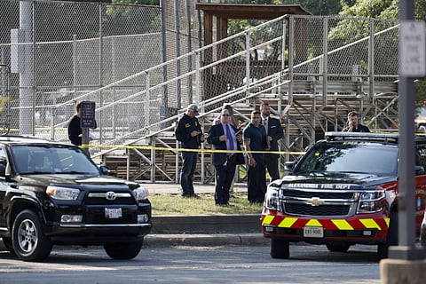 Law enforcement officers investigate the scene of a shooting near a baseball field in Alexandria, Va., Wednesday, June 14, 2017, where House Majority Whip Steve Scalise of La. was shot at a Congressional baseball practice. (Photo | AP)