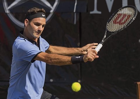 Roger Federer of Switzerland returns the ball to Germany's Tommy Haas during their match at the Mercedes Cup tennis tournament in Stuttgart, Germany, Wednesday, June 14, 2017. | AP