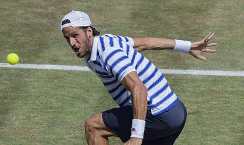 Feliciano Lopez of Spain returns a ball to Jeremy Chardy of France during their match at the Mercedes Cup tennis tournament in Stuttgart, Germany. | AP