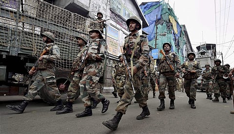 Darjeeling Security personnel patrol a road during GJM strike in Darjeeling on Saturday. (PTI)
