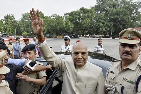 Bihar Governor Ram Nath Kovind NDA's presidential candidate waves at the media as he leaves for Delhi at Raj Bhavan in Patna on Monday. | PTI
