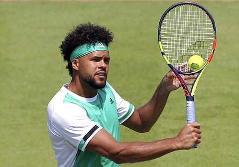France's Jo-Wilfried Tsonga returns a ball to France's Adrian Mannarino on day one of the Queen's Championships London. | AP