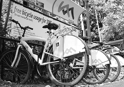 Public bike-sharing system  which allows commuters to use bicycles free of cost to travel short distances within city limits | Express