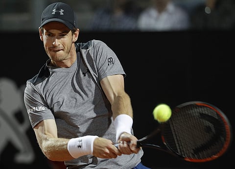 Andy Murray, of Britain, returns the ball to Fabio Fognini, of Italy, during the Italian Open tennis tournament, in Rome, Tuesday, May 16, 2017. | AP