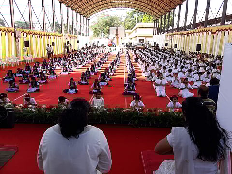 Children practise Yoga as part of International Yoga Day Celebrations and state-level yoga training programme at the Central Stadium in Thiruvananthapuram on Wednesday. (Kaviyoor Santhosh | EPS)
