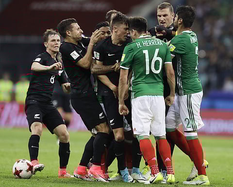 Mexico's and New Zeland's players fight during the Confederations Cup, Group A soccer match between Mexico and New Zealand, at the Fisht Stadium in Sochi, Russia. | AP