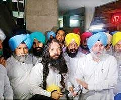 AAP leader Pirmal Singh Khalsa stands with his turban that came off after a scuffle with marshals in the Punjab Assembly on Thursday | File photo by Express
