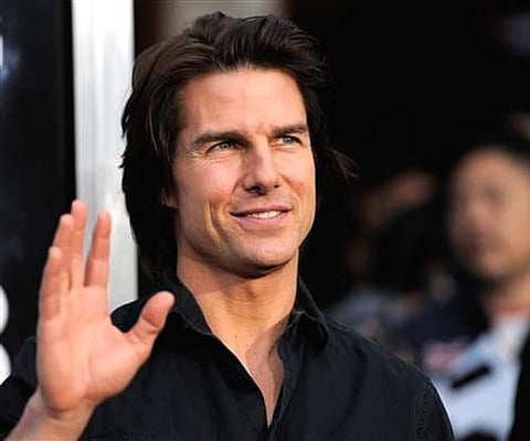 Actor Tom Cruise waves to photographers at the premiere of the film 'Super 8' in Los Angeles. (AP)
