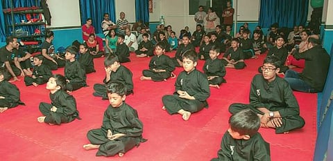 Students meditating at Shaolin Wushu Cultural Centre India, Bengaluru