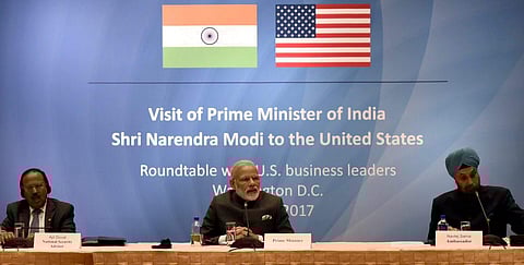 Prime Minister Narendra Modi in a round table meeting with the US Business Leaders at Washington DC USA on Sunday. NSA Ajit Doval L and Navtej Sarna Indian Ambassador to USA are also seen. | PTI
