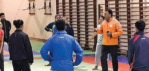 Coach Kuldeep Handoo with athletes at the national camp in Shilaroo