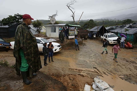 A rebel of the Revolutionary Armed Forces of Colombia, FARC, stands guard at the Mariana Paez demobilization zone, one of many rural camps where rebel fighters are making their transition to civilian life, in Buenavista, in the municipality of Mesetas, Co