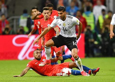 Germany's Emre Can jumps over Chile's Arturo Vidal during the Confederations Cup, Group B soccer match between Germany and Chile, at the Kazan Arena. | AP